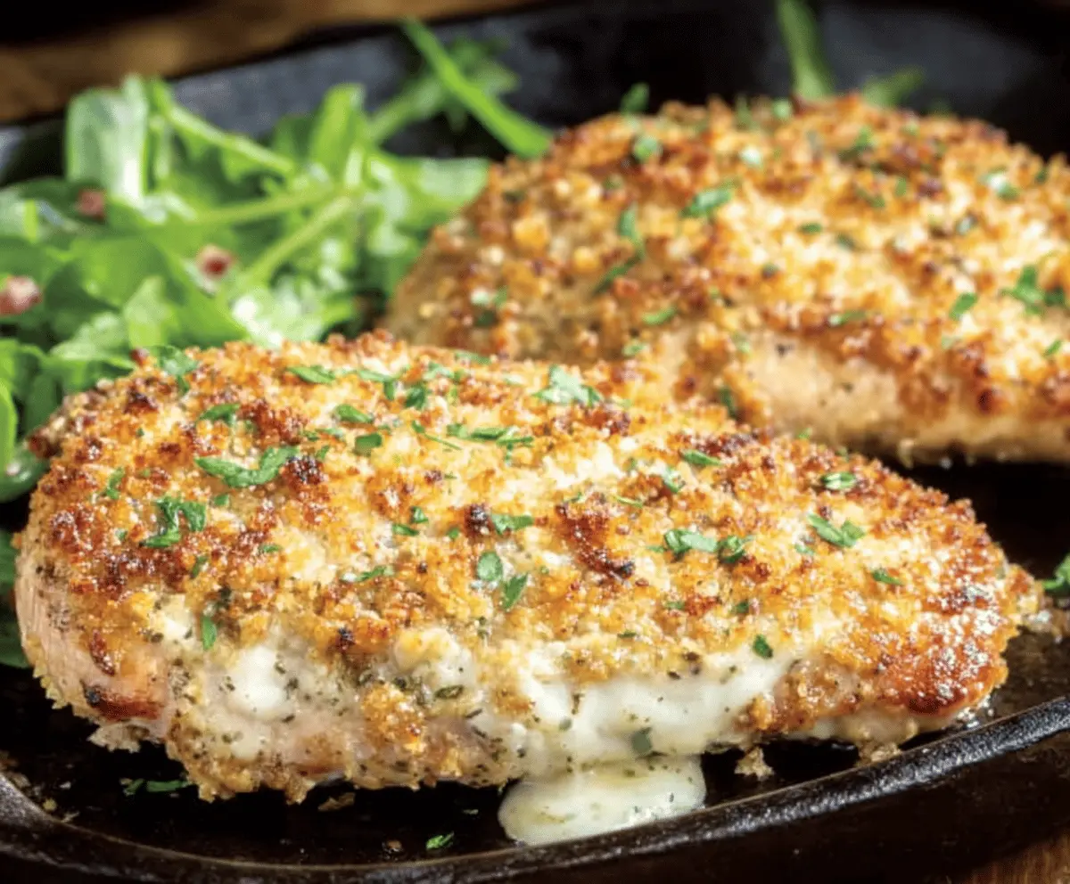 Delicious Parmesan Chicken served at Longhorn Steakhouse, garnished with fresh herbs and golden cheese.