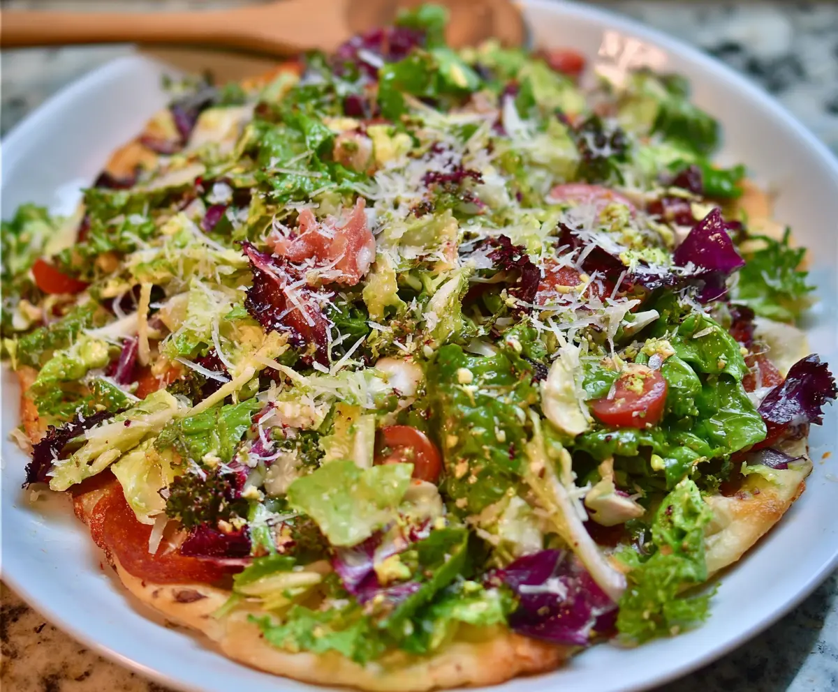 Fresh Pizza Night Salad with mixed greens, cherry tomatoes, and mozzarella cheese for a delicious and healthy dinner.